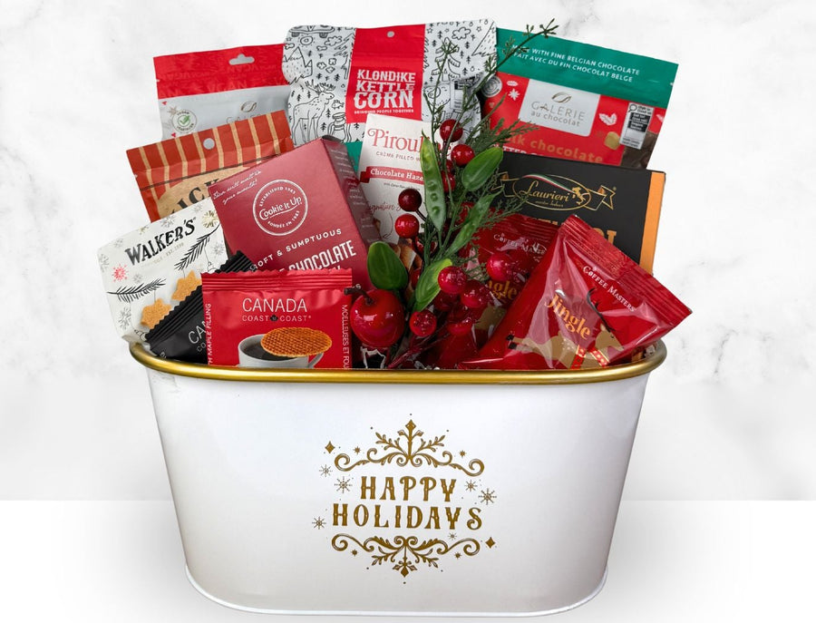 Gift basket with festive items on a white marble background