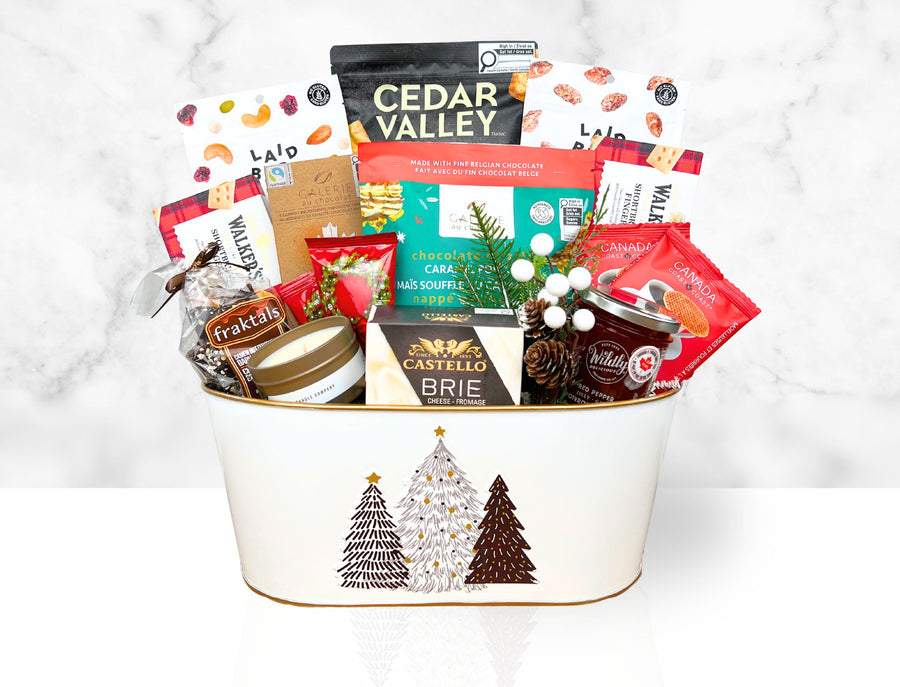 Gift basket with various snacks and treats on a white background